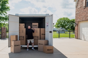 Man loading a portable storage container for moving