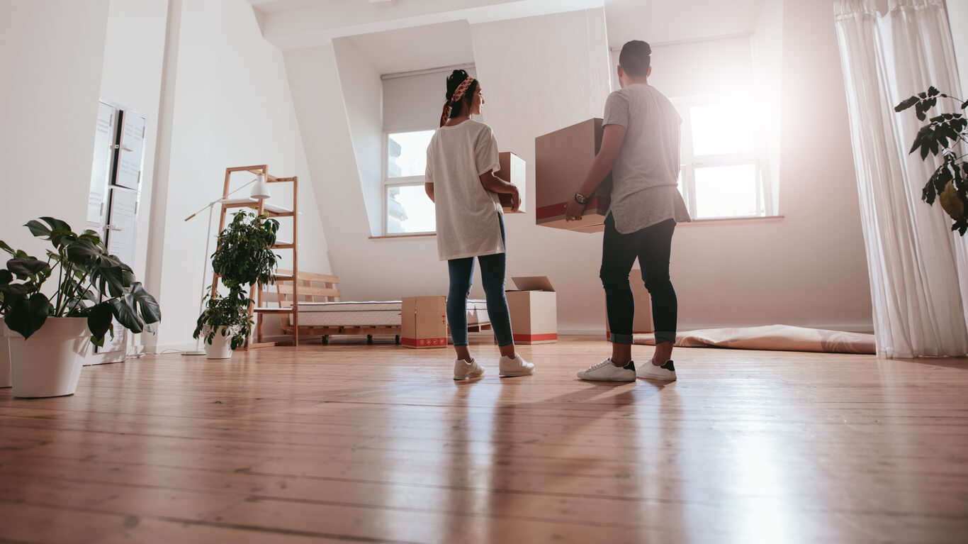 two young people moving into an apartment