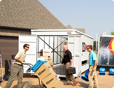 Guys unloading Go Mini's Container