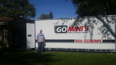 man in front of go minis on lawn