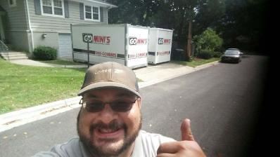 thumbs up man in front of go minis unit
