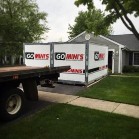 two go minis units on driveway with truck