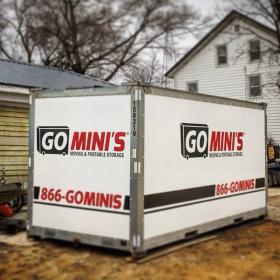 go minis unit on driveway with garage