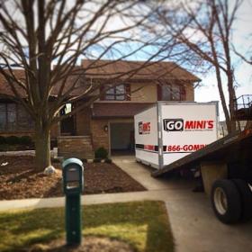 go minis unit on driveway with truck