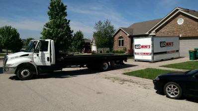 go minis unit on driveway with truck